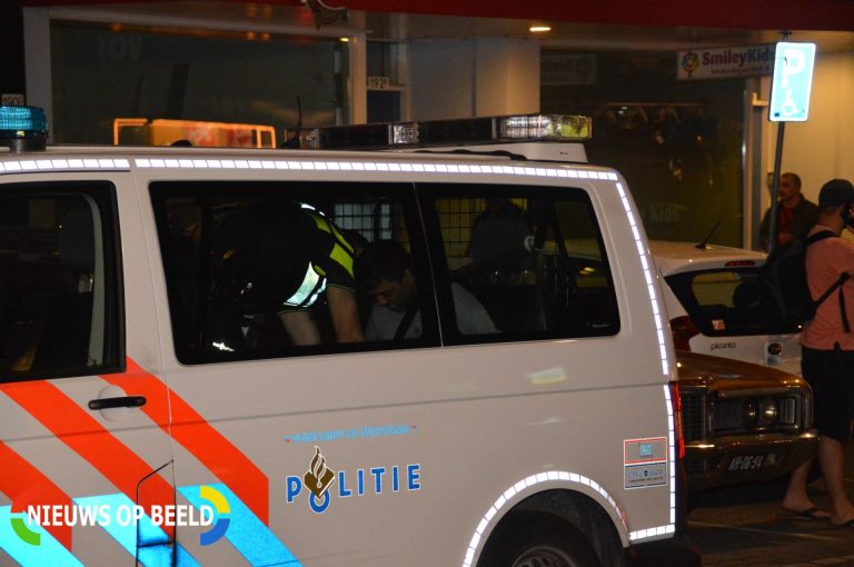 Verwarde man door brandweer van dak gehaald en aangehouden Hilledijk Rotterdam