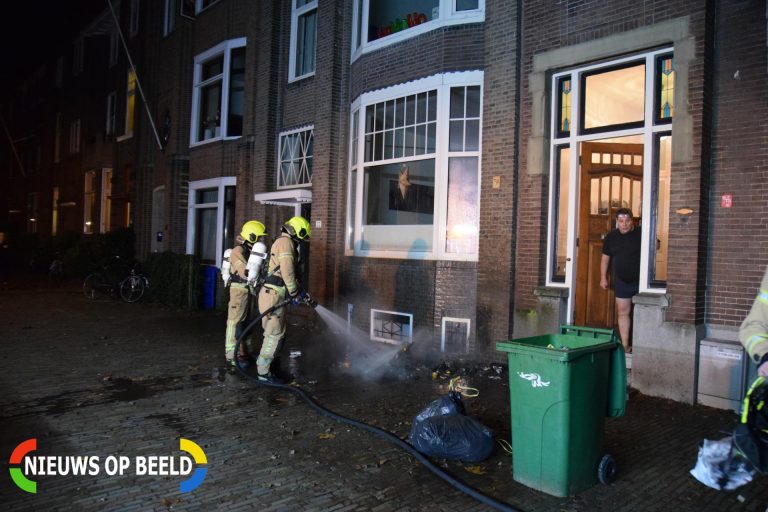 Kliko in brand tegen gevel van woning Kralingse Plaslaan Rotterdam