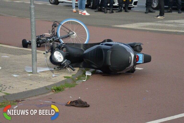 Ongeluk op de Melanchtonweg in Rotterdam-Schiebroek: Twee gewonden na aanrijding tussen fietser en scooter