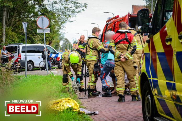Persoon met scootmobiel te water Bermweg Capelle aan den IJssel
